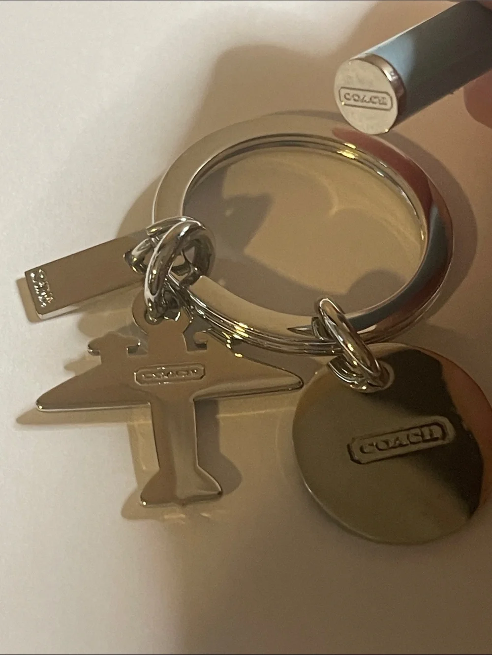 Coach Silver Airplane Keyring with Light Blue Round Charm and Coach Pen
